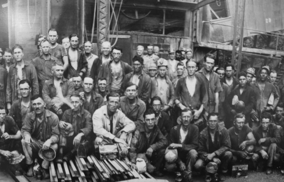 Historical photo of miners with lunch pails