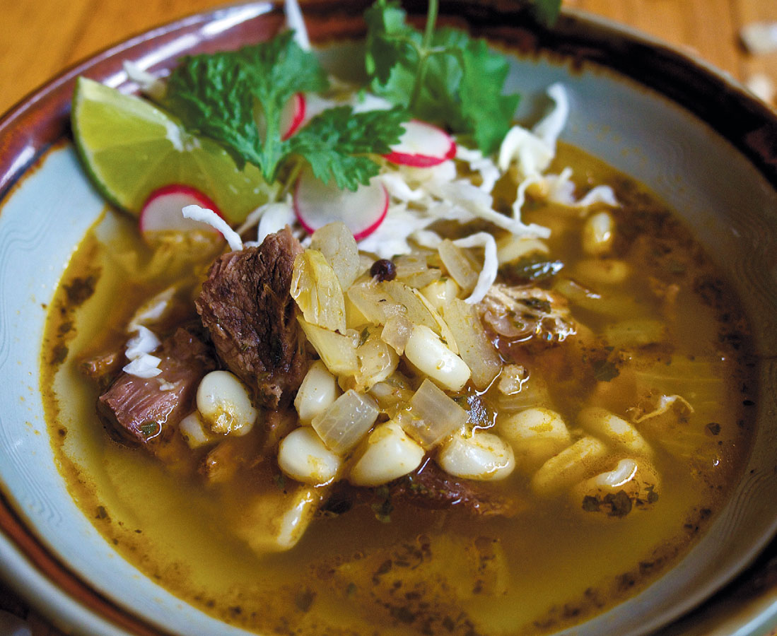 Red posole with garnishes