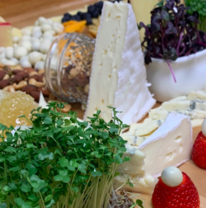 cheese and fruit plater with Phoenix Microgreens