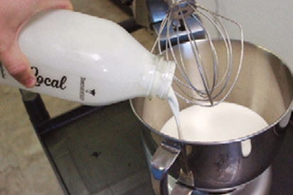 Pouring cream into mixer