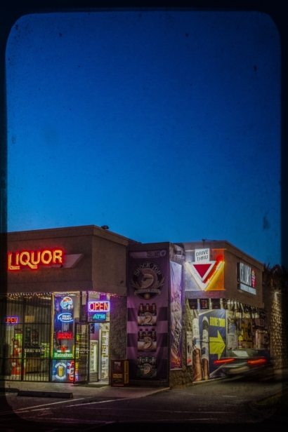 Liquor store sign at dusk