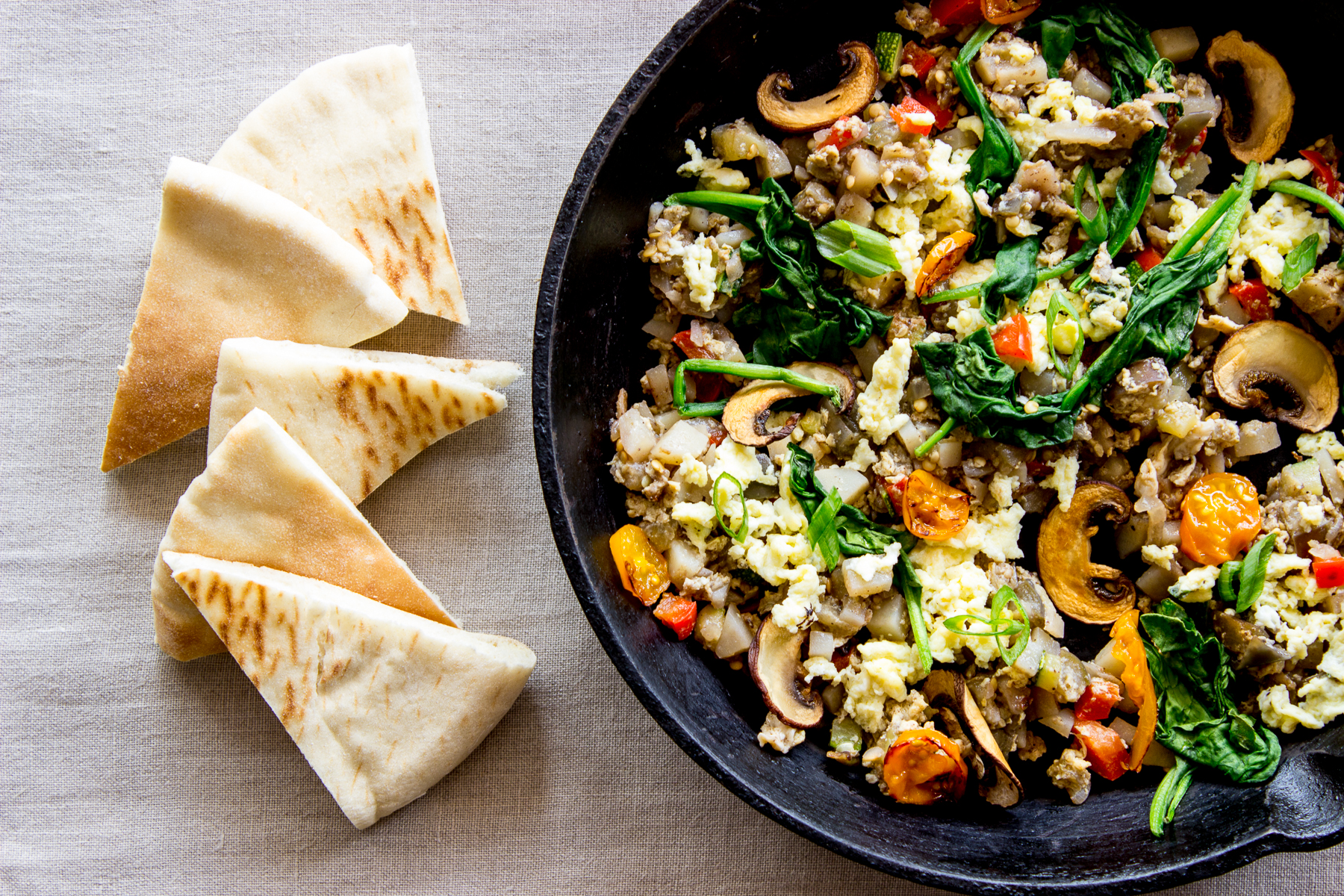 Egg and vegetable hash with pita bread