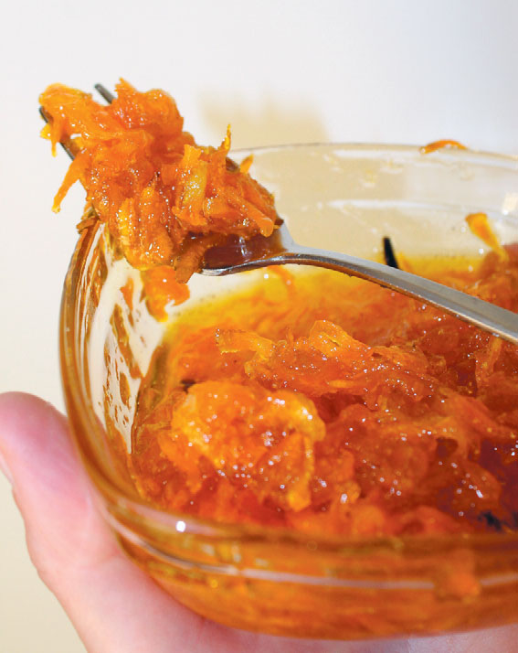 Carrot jam with spoon